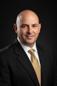 H.E. Sir CHRYSOSTOMOS VASSILI